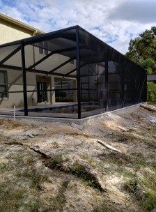 Patio footer and aluminum enclosure foundation area